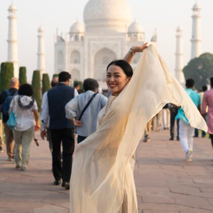 Portrait of an Asian woman with the Taj Mahal in the background